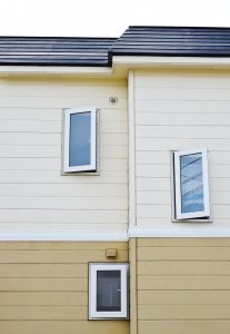 tan and brown siding on house